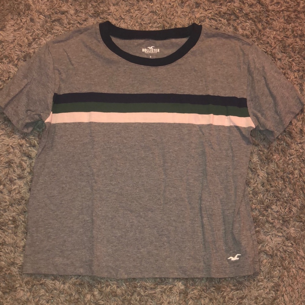 gray t-shirt with navy, green, and white stripes